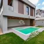 CASA RESIDENCIAL NO BAIRRO PEDRA BRANCA, EM PALHOÇA, SC, SACADA, ESPAÇO GOURMET, CHURRASQUEIRA, PISCINA, 3 DORMITÓRIOS SENDO 3 SUÍTES, 2 VAGAS GARAGEM