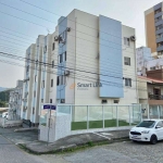 Apartamento com 2 dormitórios à venda, 58 m² por R$ 299.900,00 - Barreiros - São José/SC