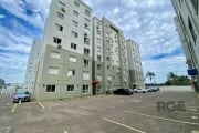 Apartamento em Torres  com três dormitórios sendo uma suite , living com dois ambientes , banho social , cozinha com churrasqueira , vaga para  um carro , condominio com infra , pracinha e espaço  gou