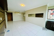 Apartamento com 95m² de  três dormitórios, uma suíte, living com dois ambientes,  churrasqueira, possibilidade de colocar lareira, cozinha, banheiro social, e um lavado, com duas vagas cobertas escrit