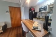 Lindo apartamento três dormitórios, sendo uma suíte.&lt;BR&gt;Living dois ambientes, cozinha americana e área de serviço.&lt;BR&gt;Imóvel em andar alto ficando semimobiliado com móveis planejados, ban