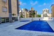 Apartamento com terraço gourmet à venda na praia do Guarujá .