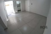 VENDO ALUGADO  Apartamento JK térreo no bairro Santana em Porto Alegre,  todo reformado, piso em ceramica, área externa aberta, Ar Condicionado SPLIT instalado, cozinha com armários e fogão CookTop,  