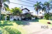 Casa em condomínio com 321m², 4 suítes e 6 vagas no bairro Terraville.&lt;BR&gt;&lt;BR&gt;Imóvel possui ampla área social com living 4 ambientes com lareira, hall de entrada, espaço gourmet com churra