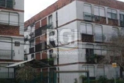 VENDE, apartamento térreo com 1 dormitório, living para 2 ambientes, cozinha, área de serviço fechada, banheiro social, piso frio. Gradeado. Prédio com segurança.