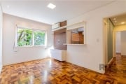 Encante-se com este Apartamento Ensolarado de 1 Dormitório no Menino Deus. Seja bem-vindo a este encantador apartamento de frente, situado em uma rua tranquila no coração do desejado bairro Menino Deu