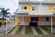 Excelente sobrado de esquina em condomínio fechado a venda em Canoas, bairro Olaria. Primeiro pavimento conta com sala de estar e jantar integradas com sanca em gesso, lavabo, cozinha, banheiro social