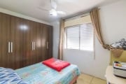 Apartamento com 2 dormitórios, sala, cozinha, banheiro social, e vaga de garagem.