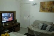 Apartamento térreo, todo em porcelanato e rebaixado em gesso. Com ótima ventilação e privacidade. Sol da tarde.&lt;BR&gt;2 dormitórios, sala, cozinha e banheiro, com vaga rotativa.&lt;BR&gt;Condomínio