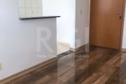 Vende apartamento com  2 dormitórios, 1 banheiro, cozinha Americana e living para 2 ambientes.  .  1 vaga de garagem.  Condomínio fechado com portaria 24h,  salão de festas, zeladoria,  playground, ch