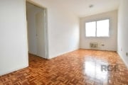 Libertas Imobiliária aluga apartamento com 69m² no bairro Menino Deus.&lt;BR&gt;&lt;BR&gt;Imóvel de 2 dormitórios, dependência, amplo living, piso em parquet, área de serviço fechada, ar condicionado,