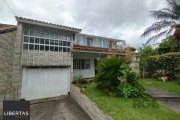 Casa em Porto Alegre, no bairro Ipanema, com 6 dormitório(s), e 3 vagas para loc
