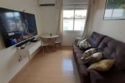 Excelente apartamento de 02 dormitórios no Bairro Santo Antônio, reformado com piso laminado, split, sala, cozinha e área de serviço. Andar alto com excelente vista no condomínio arborizado com portar