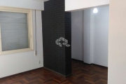 Apartamento de um dormitório semi mobiliado  no centro