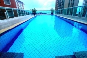 Apartamento 2 dormitorios com sacada gourmet e lazer completo apenas 130m do mar na Vila tupi