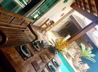 Casa alto padrão no bairro Cidade Jardim com três suítes e área gourmet.