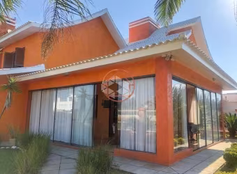 Casa em condomínio fechado com 5 quartos à venda na Das Orquídeas, 124, Capão Novo, Capão da Canoa por R$ 1.804.000