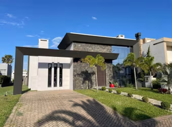 Casa em condomínio fechado com 3 quartos à venda na Rua Onório Germano, 2009, Araça, Capão da Canoa por R$ 1.200.000
