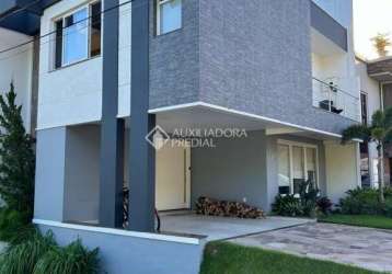 Casa em condomínio fechado com 3 quartos à venda na rua ivo walter kern, 599, hípica, porto alegre, 260 m2 por r$ 1.350.000