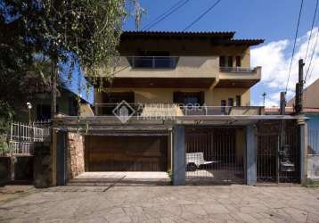 Casa em condomínio fechado com 4 quartos à venda na rua pinto da rocha, 383, partenon, porto alegre, 250 m2 por r$ 890.000