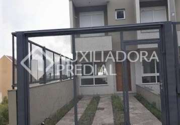 Casa em condomínio fechado com 2 quartos à venda na rua henrique anawate, 514, guarujá, porto alegre, 125 m2 por r$ 460.000