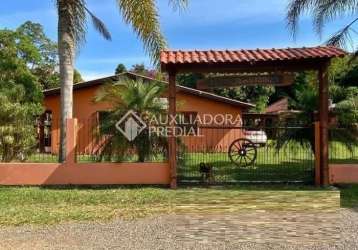 Casa em condomínio fechado com 3 quartos à venda na rs 040, 1265, zona rural, viamão, 300 m2 por r$ 600.000