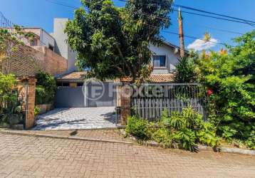 Casa em condomínio fechado com 3 quartos à venda na estrada joão passuelo, 1060, vila nova, porto alegre, 192 m2 por r$ 720.000