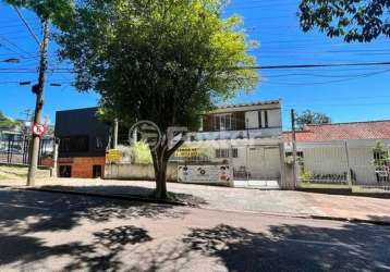 Casa com 3 quartos à venda na rua joão bastian, 24, três figueiras, porto alegre, 332 m2 por r$ 1.280.000