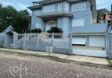 Casa com 1 quarto à venda na rua theonila carvalho da motta, 174, parque santa fé, porto alegre, 650 m2 por r$ 1.800.000