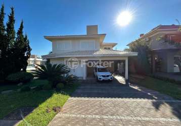 Casa em condomínio fechado com 3 quartos à venda na avenida senador salgado filho, 8500, querência, viamão, 459 m2 por r$ 1.690.000