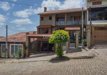 Casa com 3 quartos à venda na rua inês vinhas, 45, espírito santo, porto alegre por r$ 1.090.000