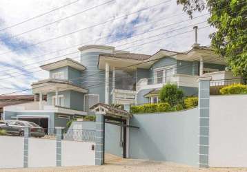 Casa em condomínio no saguaçú com 4 quartos para venda, 600 m²