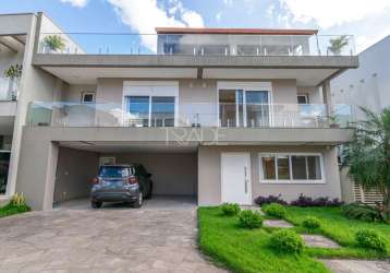 Casa em condomínio fechado com 4 quartos à venda na rua ivo walter kern, 599, hípica, porto alegre por r$ 1.860.000