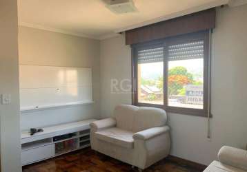 Vende apartamento de 02 dormitórios de frente, banheiro social, cozinha americana.