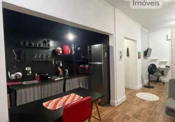 Sala living com garagem rotativa no canto do forte - sp