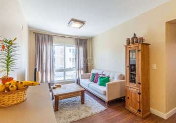 Excelente apartamento 2 dormitórios com suíte, cozinha  montada, bancada americana, área de serviço com aquecedor juncker, living com 2 ambientes. vista livre, com piso laminado, banheiro social, e do