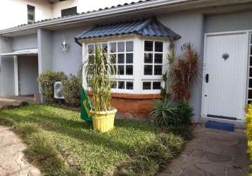 Casa térrea com 3 dormitórios sendo 01 suíte com closet, sala dois ambientes, lareira e lavabo, cozinha ampla, gás central e lavanderia. garagem fechada dois carros. área de churrasqueira com banheiro