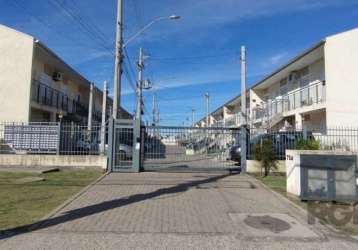 Casa em andar térreo em condomínio fechado, semi mobiliada no bairro aberta dos morros, de 2 dormitórios, living para dois ambientes, banheiro com box de vidro e moveis, cozinha com moveis. pátio aos 