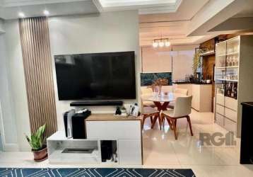 Vende-se apartamento semi mobiliado, no bairro cristo redentor, com vista definida, 3 dormitórios com suíte, 2 vagas, living amplo com cozinha americana integrada com churrasqueira, área de serviço se