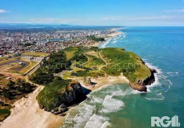 Ilhas park - torres - espetacular terreno no condominio ilhas park proximo ao mar. terreno fundo lago, posição leste/oeste, vista da guarita. condominio alto padrão. estuda dação em porto alegre.