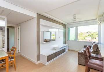 Excelente apartamento semi mobiliado no bairro camaquã! são 63m² distribuídos em espaçoso living em 'l' para dois ambientes, cozinha americana com churrasqueira, área de serviço integrada, 2