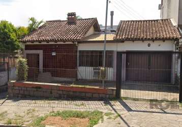 Casa no bairro partenon com  três dormitórios, sendo 1 suíte, living três ambientes, copa cozinha  e área de serviço, banheiro auxiliar e social, sala de estar com lareira e  sótão, pátio amplo e edíc