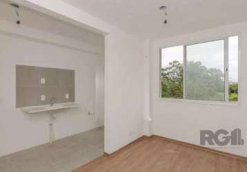 Apartamento 2 dormitórios,  living 2 ambientes, área serviço separada, cozinha americana com churrasqueira, laminado pronto para morar, prédio semi novo, com portaria, salão festas, quadra de esportes