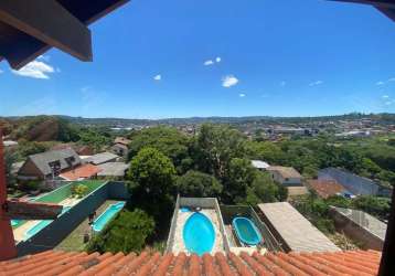 Grande oportunidade próximo ao zaffari, foco3 imóveis. vende com exclusividade, excelente sobrado 3 pavimentos, 3dormitorios, sendo uma suíte, sacada, lareira, sótão com vista panorâmica ampla varanda