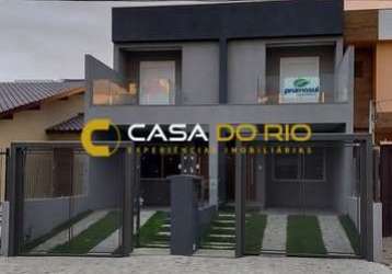 Casa com 3 quartos à venda na rua itacyr rossi, 33, guarujá, porto alegre por r$ 560.000