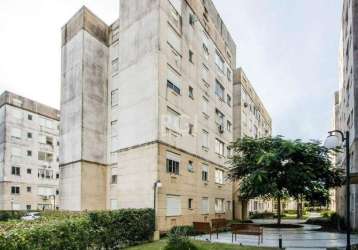 Apartamento com 2 dormitórios, amplo living que integra a sala de estar à sala de jantar com ventilador de teto, cozinha americana e com armários, área de serviço/lavanderia, banheiro com box de vidro