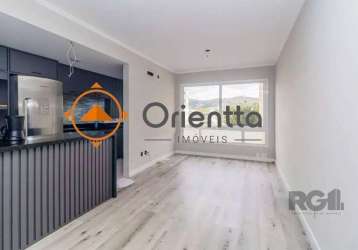 Imobiliária orientta aluga excelente apartamento semimobiliado, com 3 dormitórios, sendo 1 súite, 2 banheiros e 2 vagas de garagem. living amplo para 2 ambientes. cozinha no estilo americana, com banc