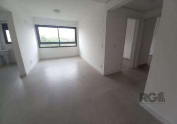 Apartamento com 63m², 2 dormitórios, 1 suíte, living de 2 ambientes, cozinha com churrasqueira, iluminação instalada, box nos banheiros, área de serviço e 1 vaga de garagem.&lt;br&gt;&lt;br&gt;condomí