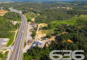 Terreno plano às margens da br-101 para construção de galpões. área total de 4.986m²