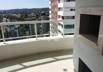 Apartamento com três dormitórios (um suíte), sacada com churrasqueira, duas vagas